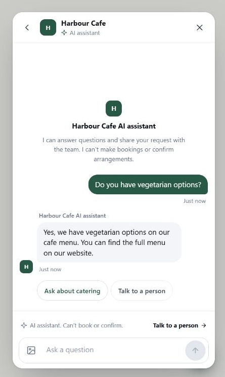 A visitor asks about vegetarian options and the Front Desk assistant gives a factual cafe answer.